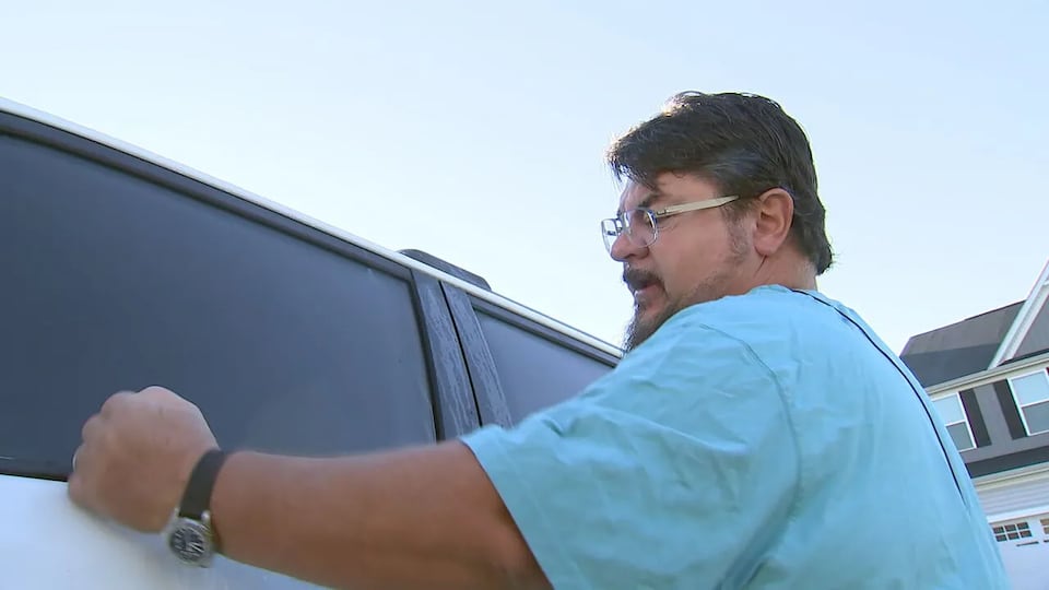 Driver escapes after masked man attempts to smash SUV window