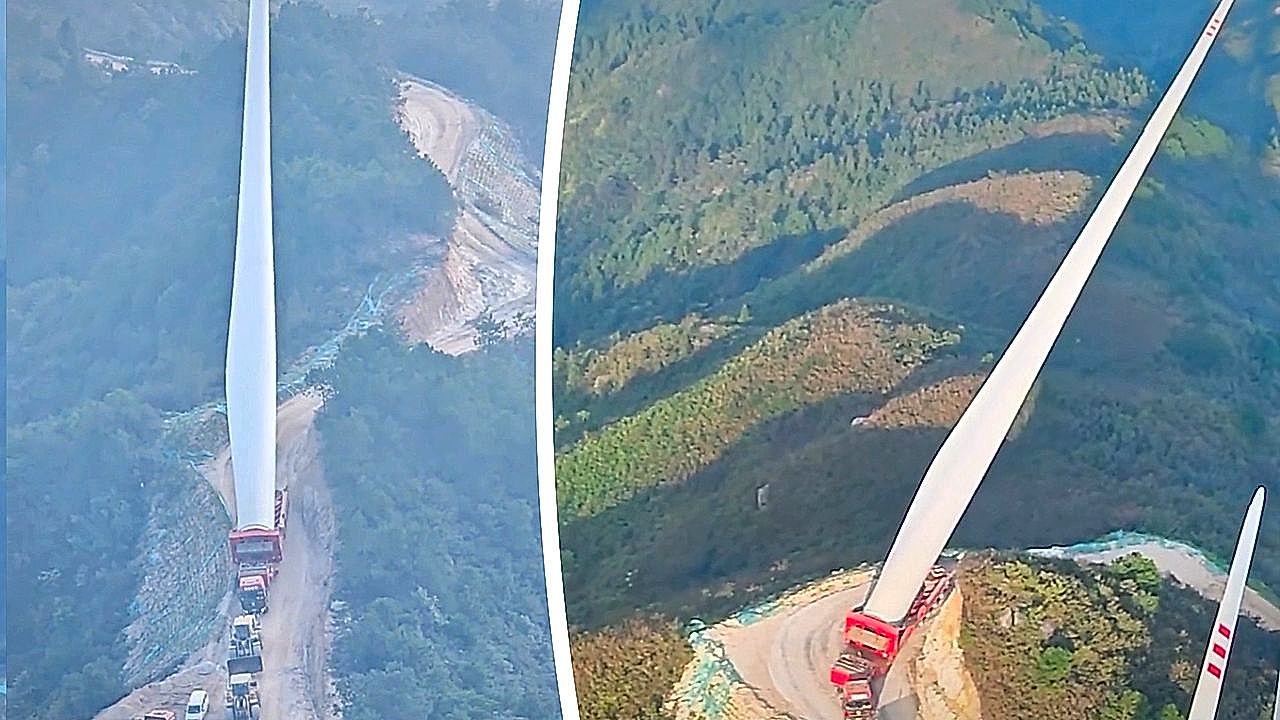 Enormous wind turbine blade transported along narrow mountain road in China