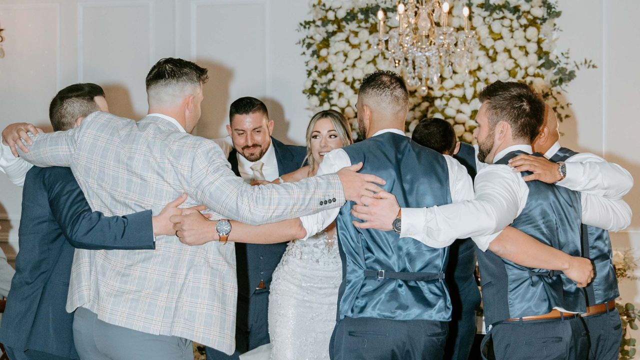 Bride dances with significant men in her life for dad-daughter dance ...