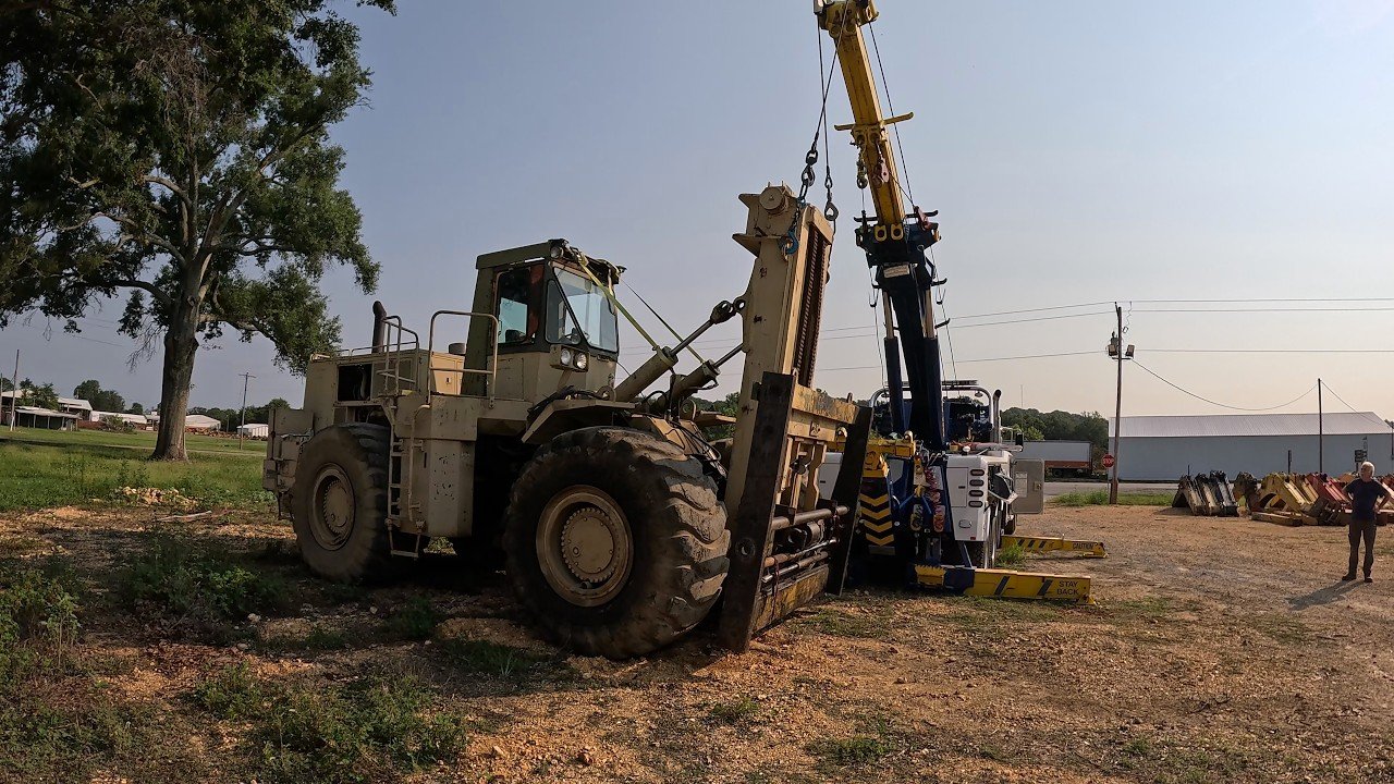 Rotator vs military 988 loader