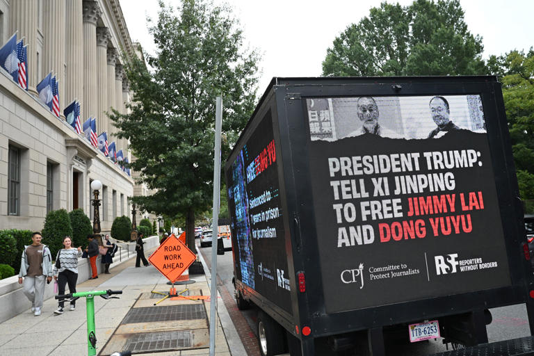 A display calls for the release of Chinese journalist Dong Yuyu and Hong Kong publisher Jimmy Lai near the White House in Washington (AFP/Getty)