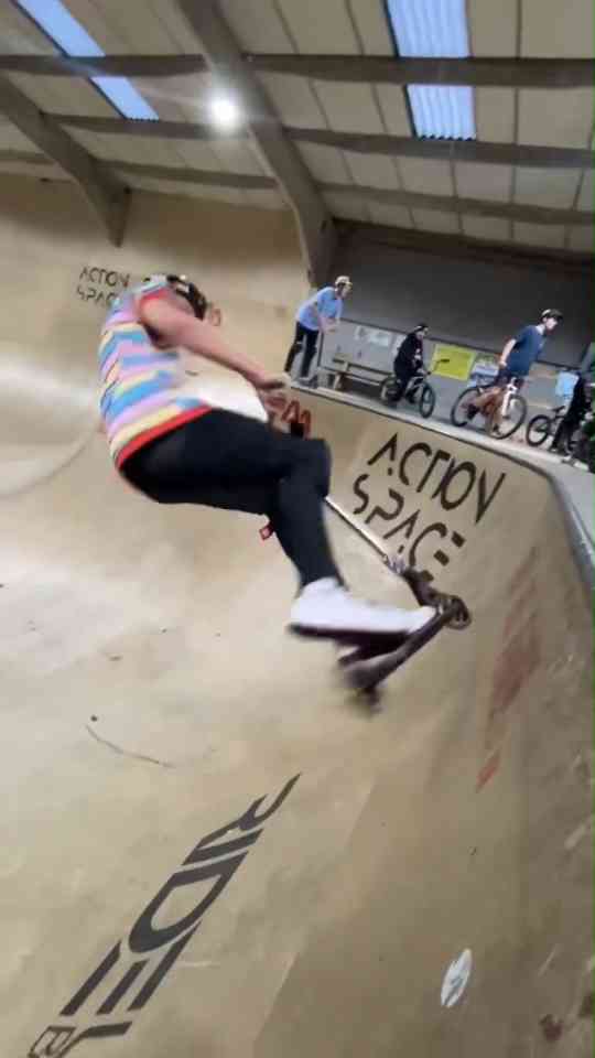Freestyle scooter riding from ramps to street obstacles