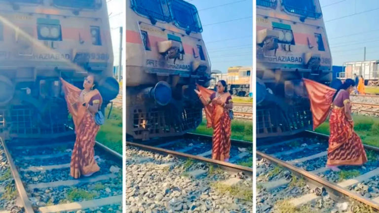 Woman ties saree pallu to stationary train, dances on railway tracks ...