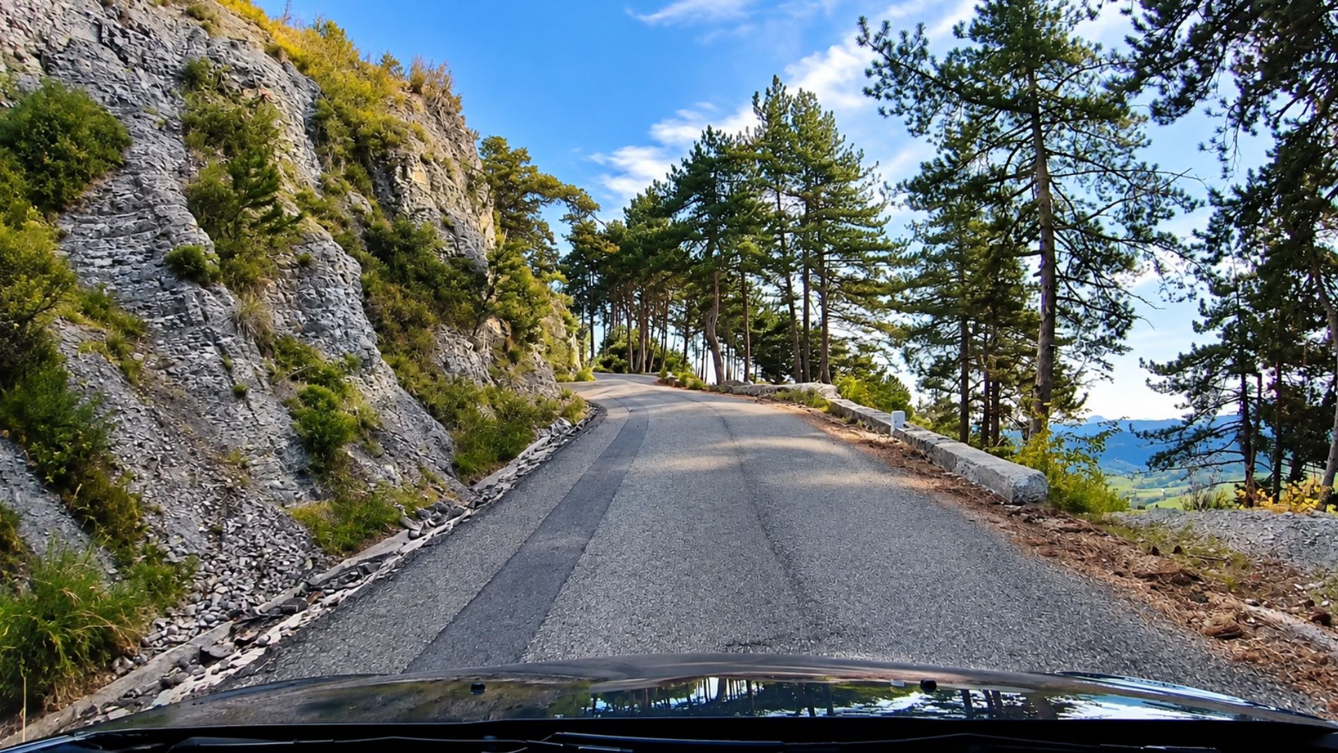 Where does this narrow road through the French Alps lead?