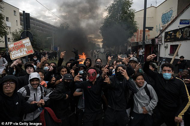 'Student' riots rock France as masked men torch schools and douse ...
