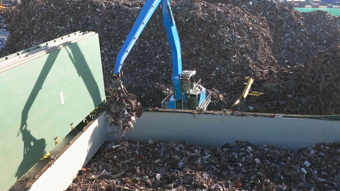Incredible heavy equipment at work in a giant recycling facility