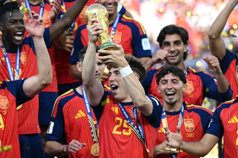 Victor Muñoz of Spain celebrates with the trophy after the FIFA World Cup Final