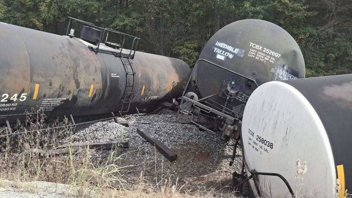 New details after 34 rail cars derail when train hits commercial ...