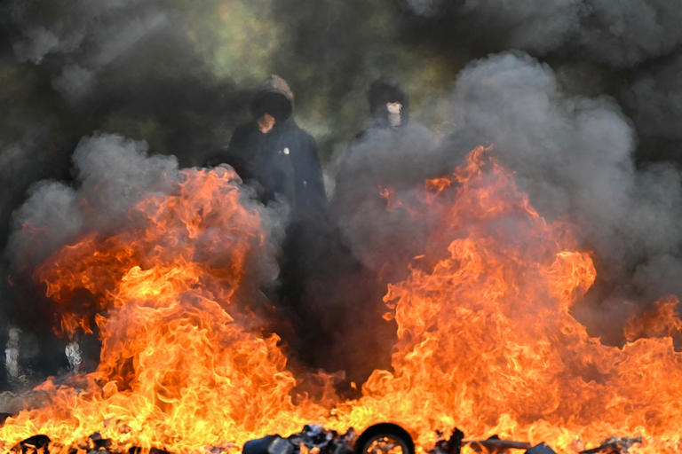 Schools set on fire in France as student riots dramatically escalate