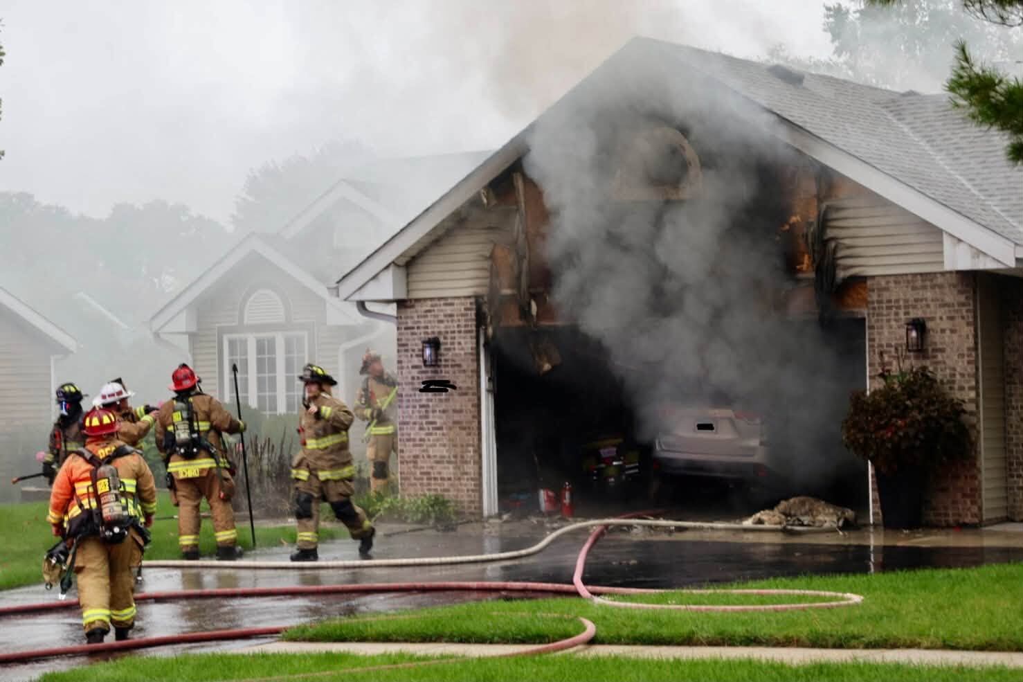 Crews battle garage fire on Denbury Lane in Loves Park