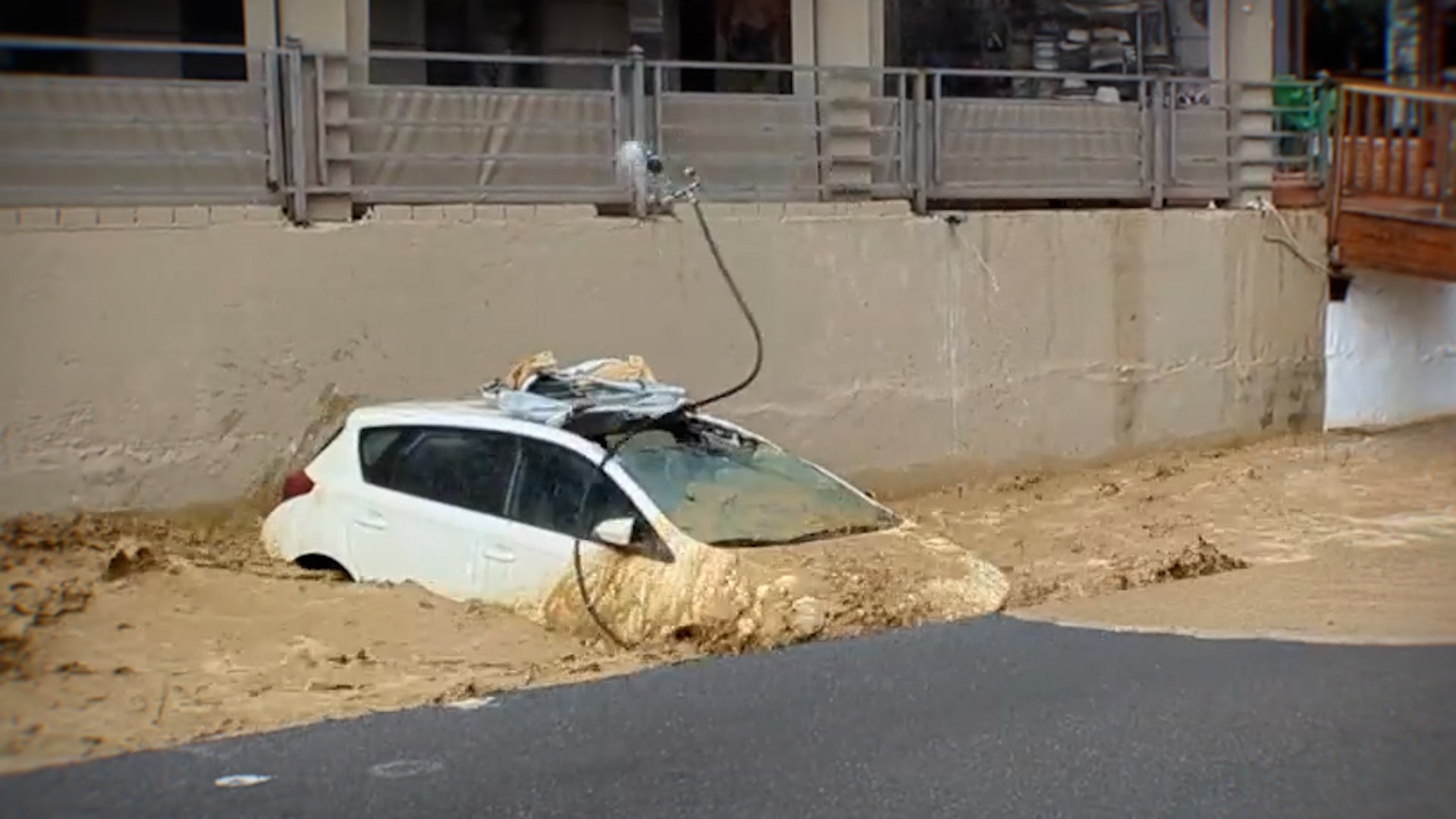 Watch: Floodwaters surge through Crete, taking cars with them