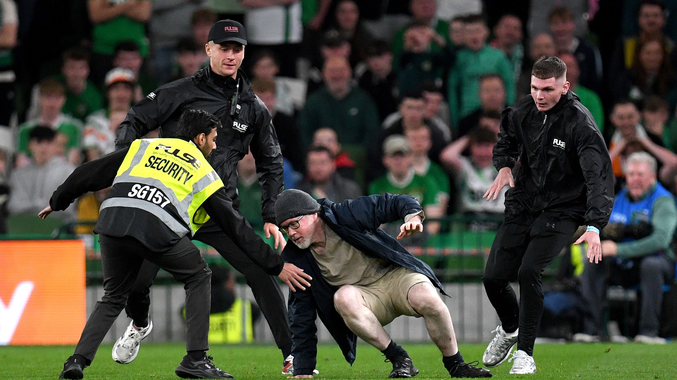 Ireland encounter with Austria paused by fan protests and pitch ...