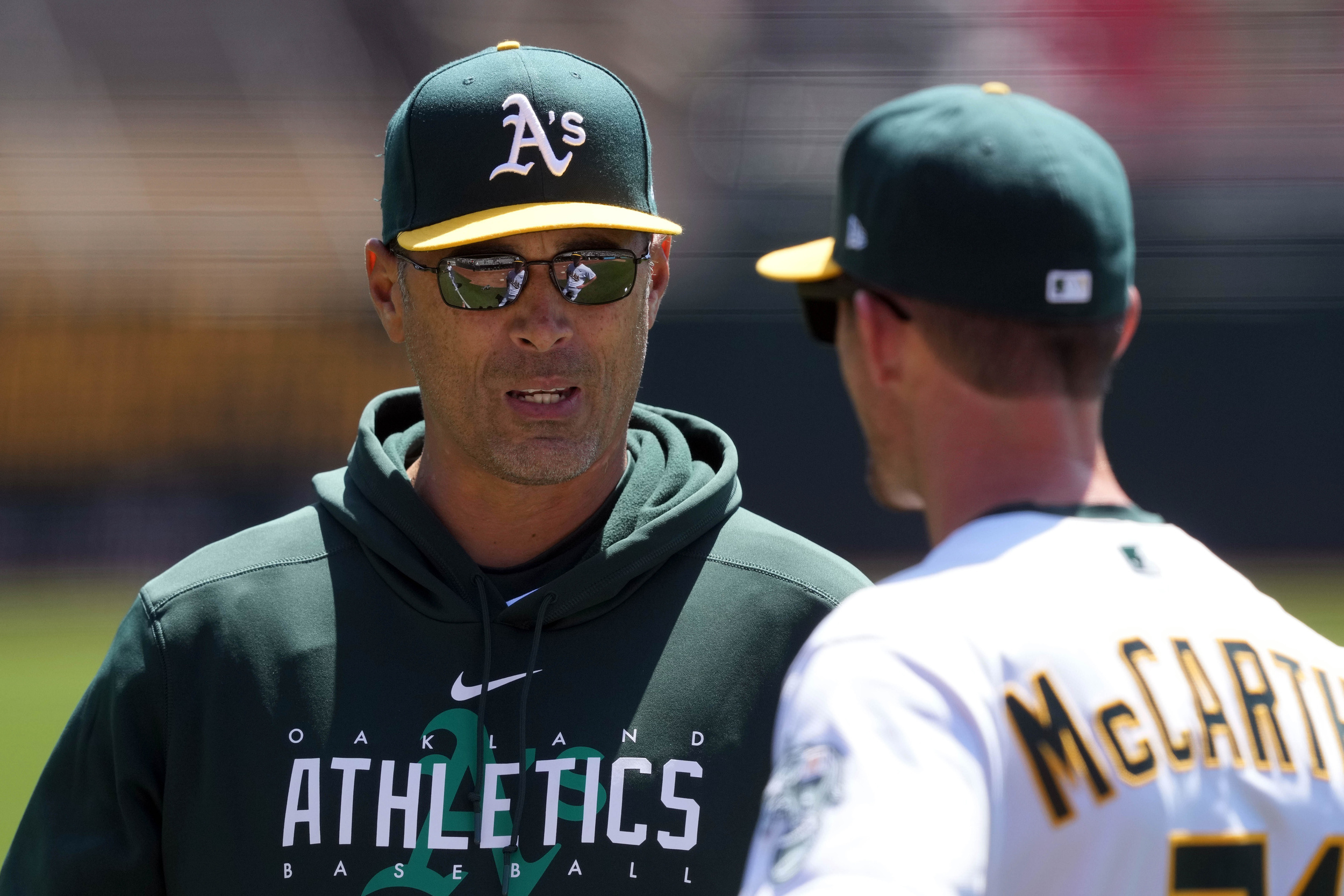 Athletics to dismiss two coaches