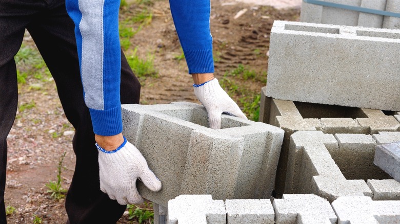 He makes an epic outdoor grill using concrete blocks