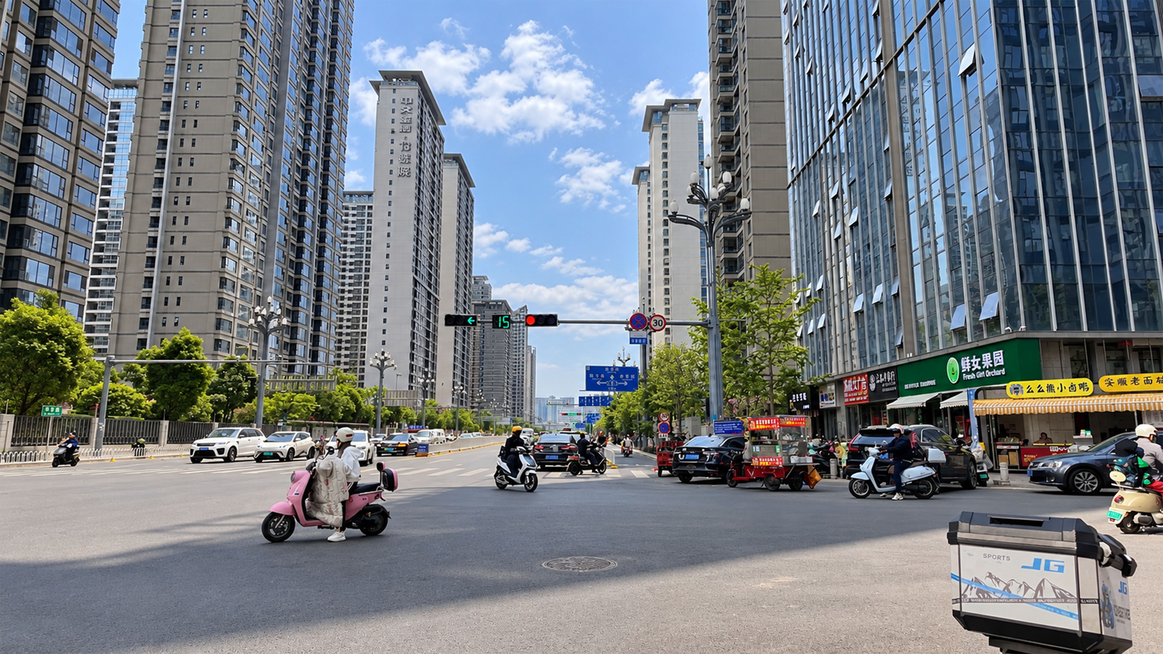 A wide Guiyang intersection shows daily life between towers