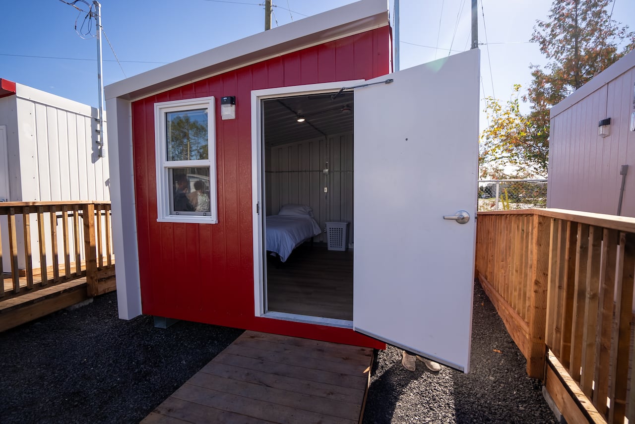 Temporary shelter village for unhoused people officially opens in ...