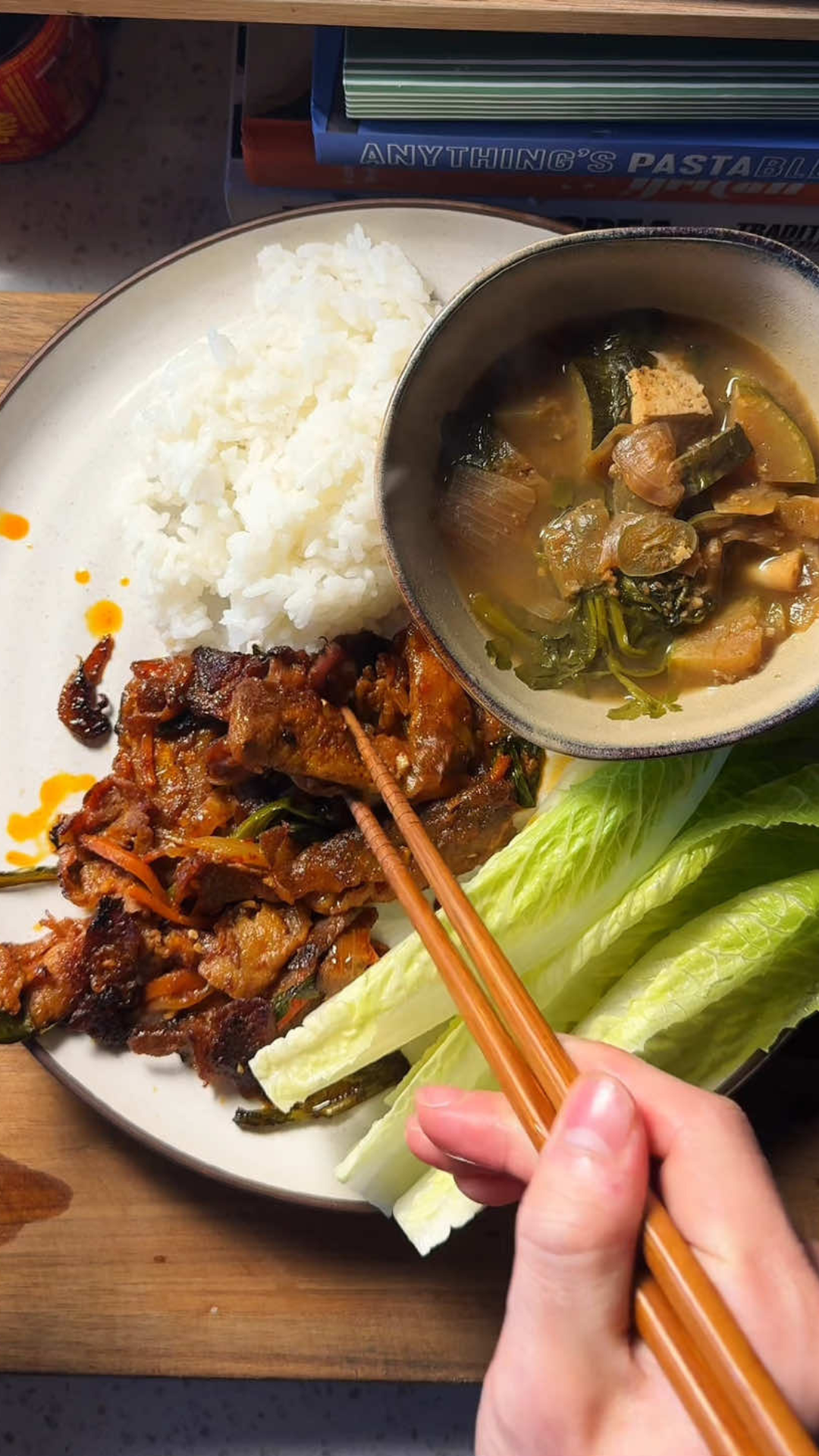 Spicy Korean pork served with rice and lettuce