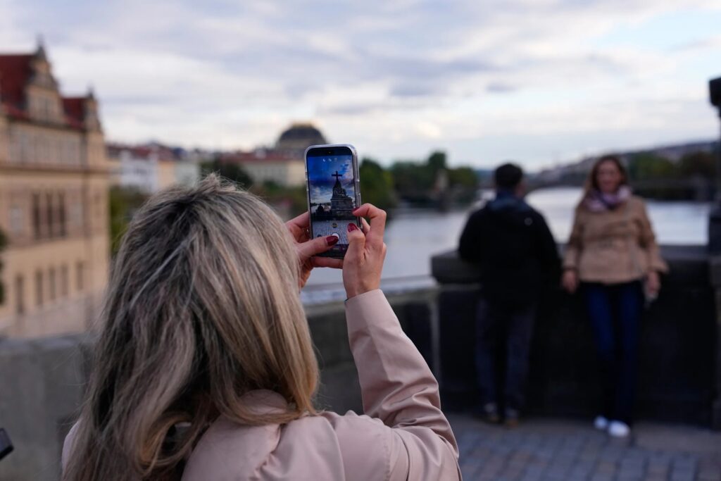 Prague’s Charles Bridge draws crowds to recreate iconic band photo