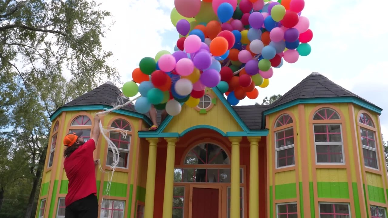 Watch what happens when enough helium balloons are tied to a full-size ...