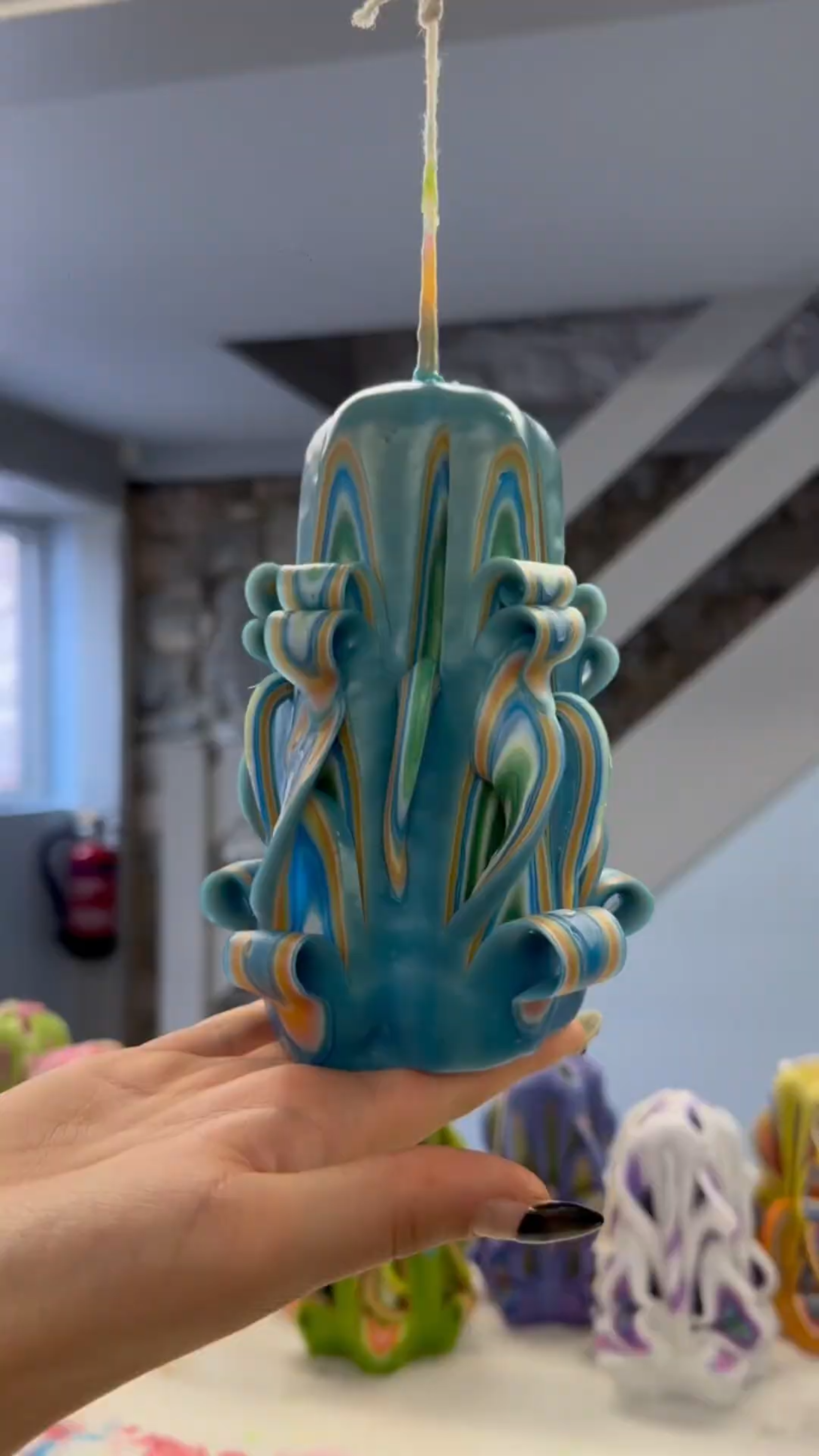 Intricate candle carving that reveals beautiful wax details