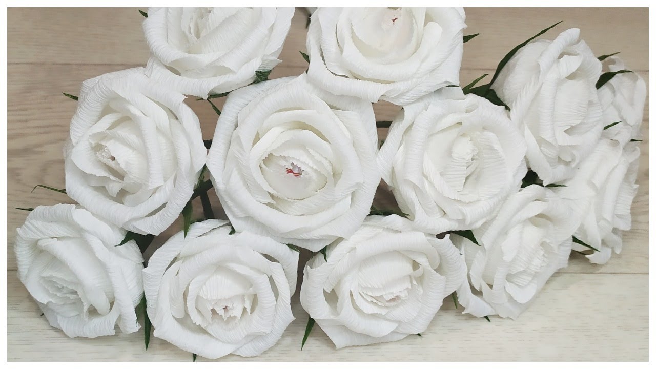 White paper roses with candy inside