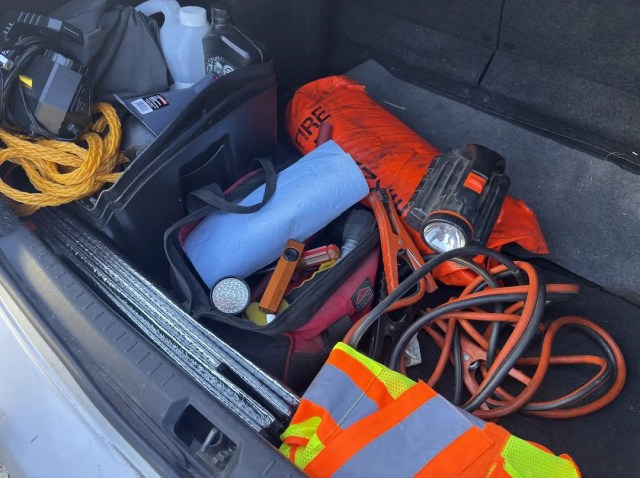 Driver checks car emergency kit, finds flashlights missing, knotted ...