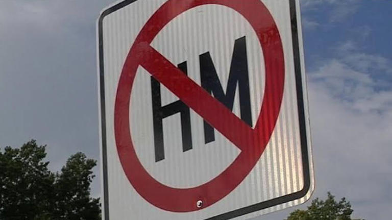 What does 'no HM' mean on a road sign?