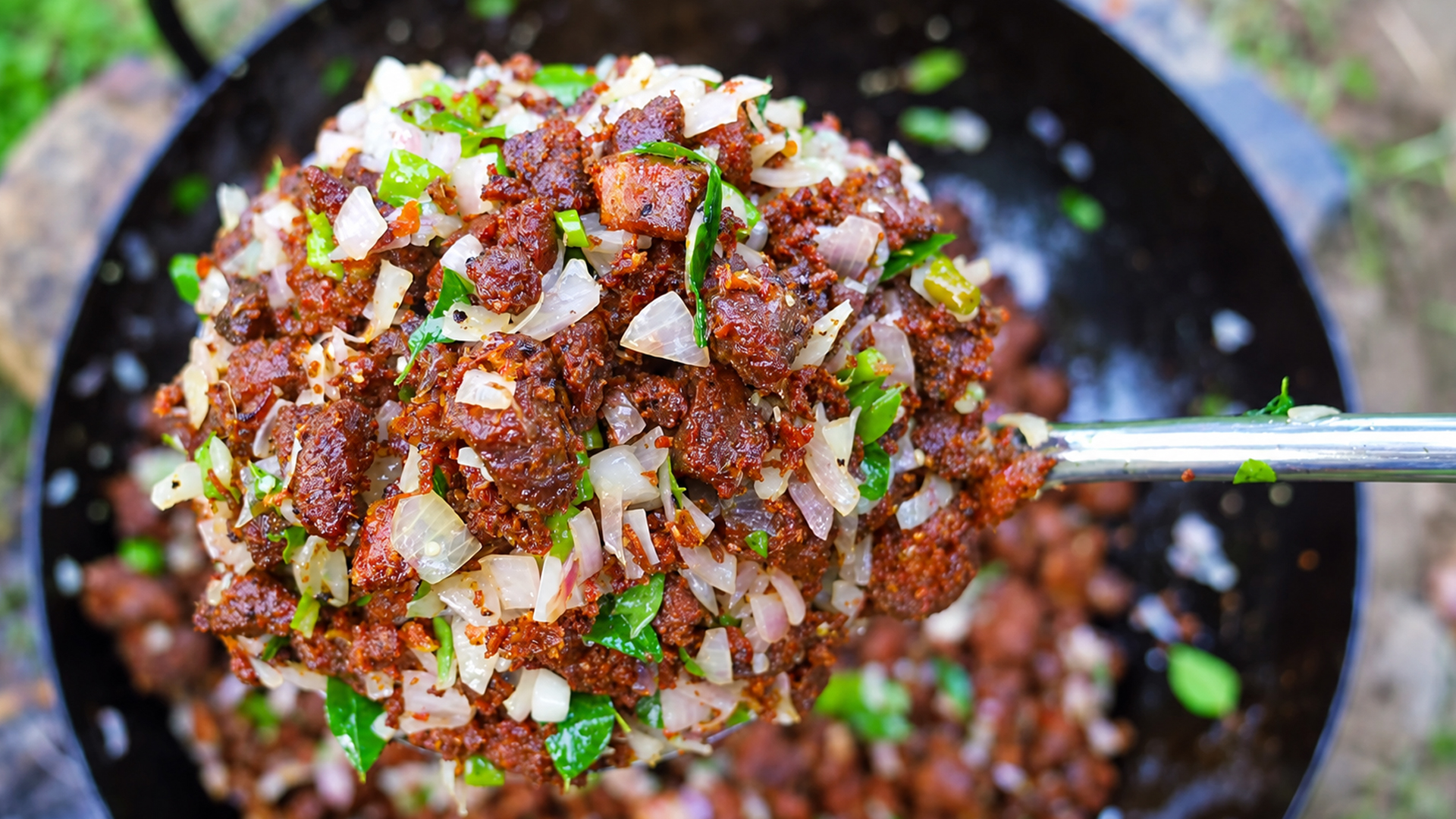 Traditional village style boneless mutton fry cooked outdoors