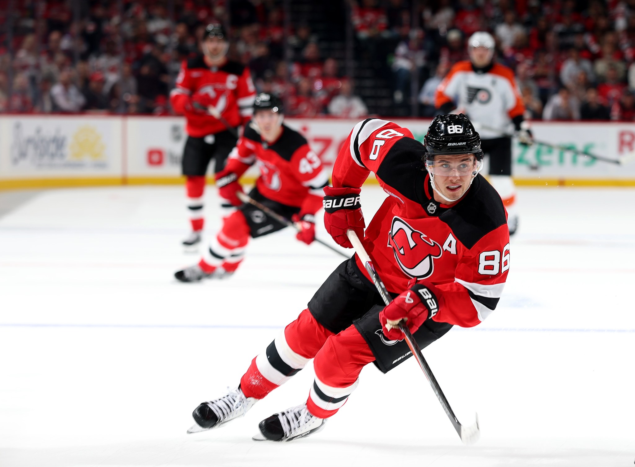 Devils star Jack Hughes has tense interaction with rink-side reporter