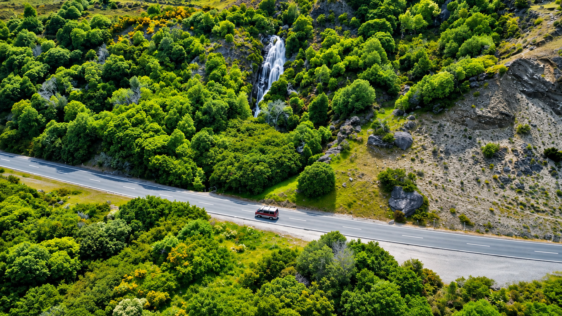 A highway cutting through New Zealand’s wild mountains