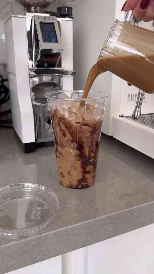 Making a chocolate iced coffee with espresso