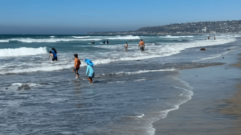 Beachgoers flock to coast to combat extreme heat in San Diego County