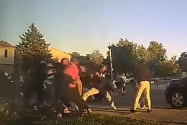 Woman accused of pouring boiling water on teen during a fight