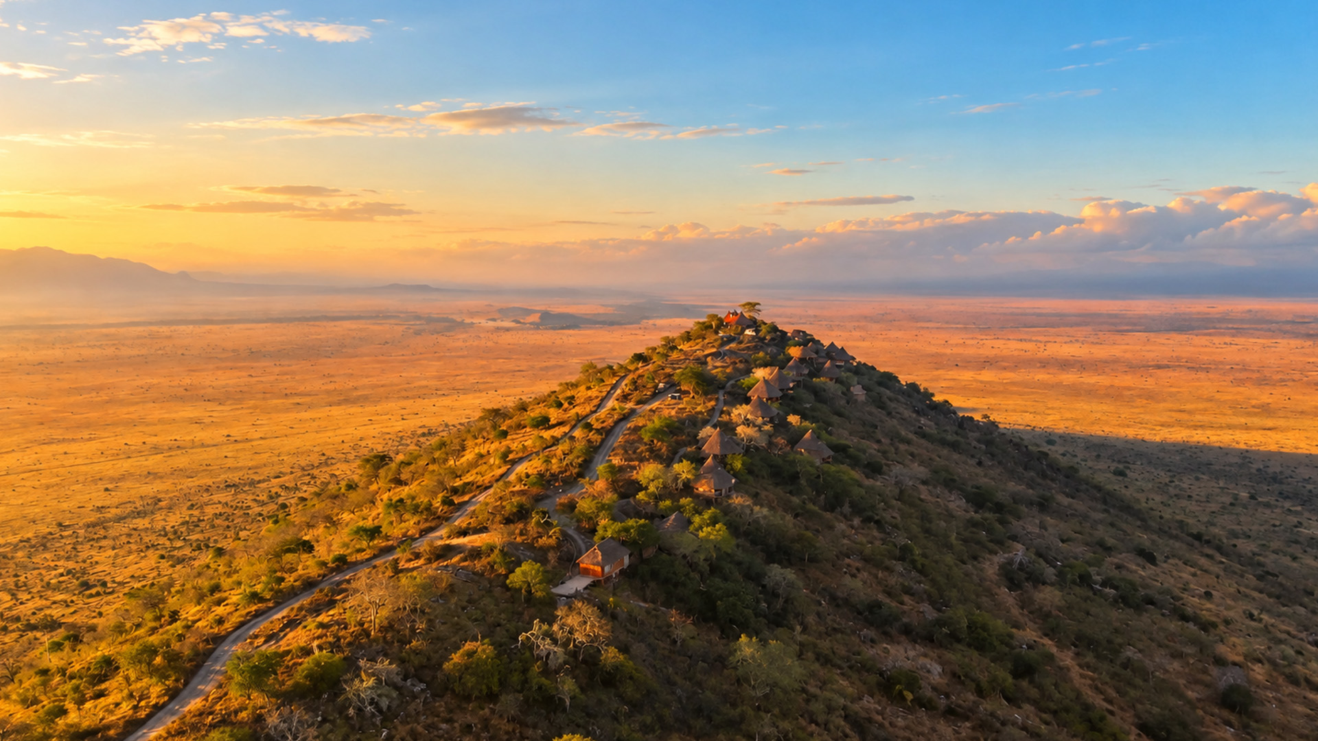 A hilltop lodge rising above Kenya’s vast savanna
