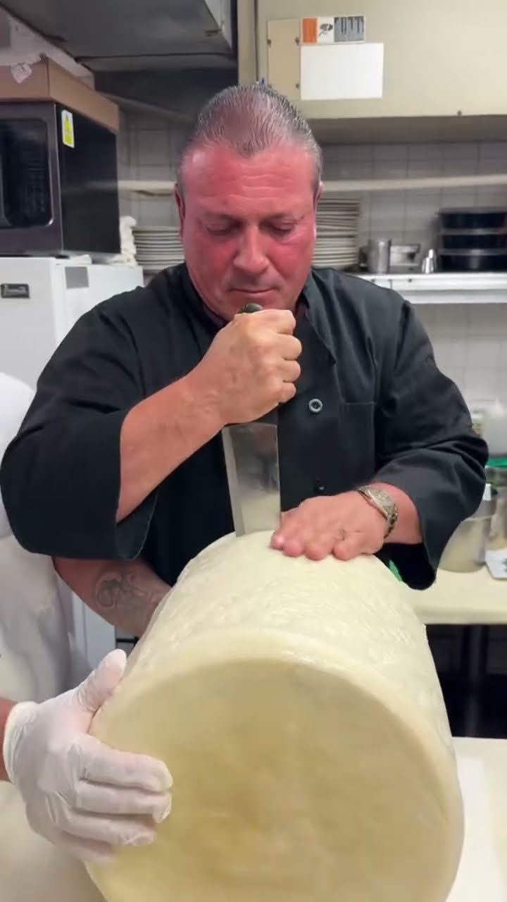 Cutting a 60lb cheese wheel 🧀