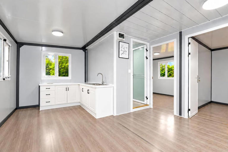 Amazon is selling a cabin-style tiny home with a warm wood-look ...