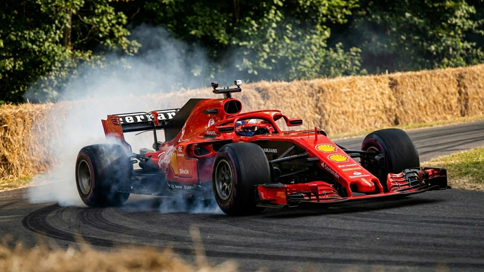 Ferrari SF71H spins its tires through a donut
