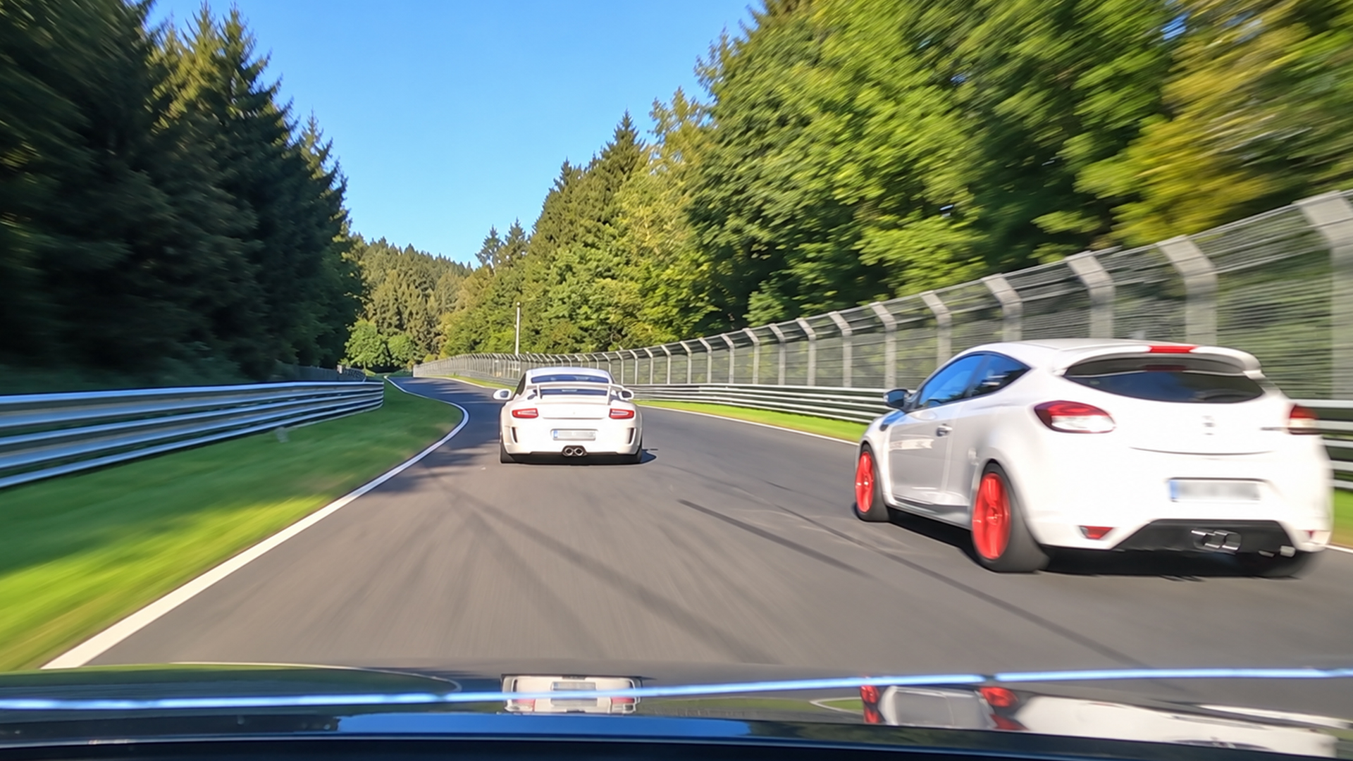 Porsche 911 leads a fast Nürburgring three-car run