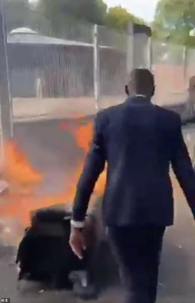 Mayor joins riots convulsing France - as firefighter is set alight