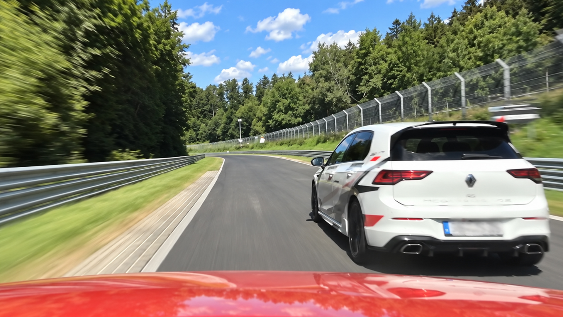 Renault Mégane RS pushes through a fast forest bend