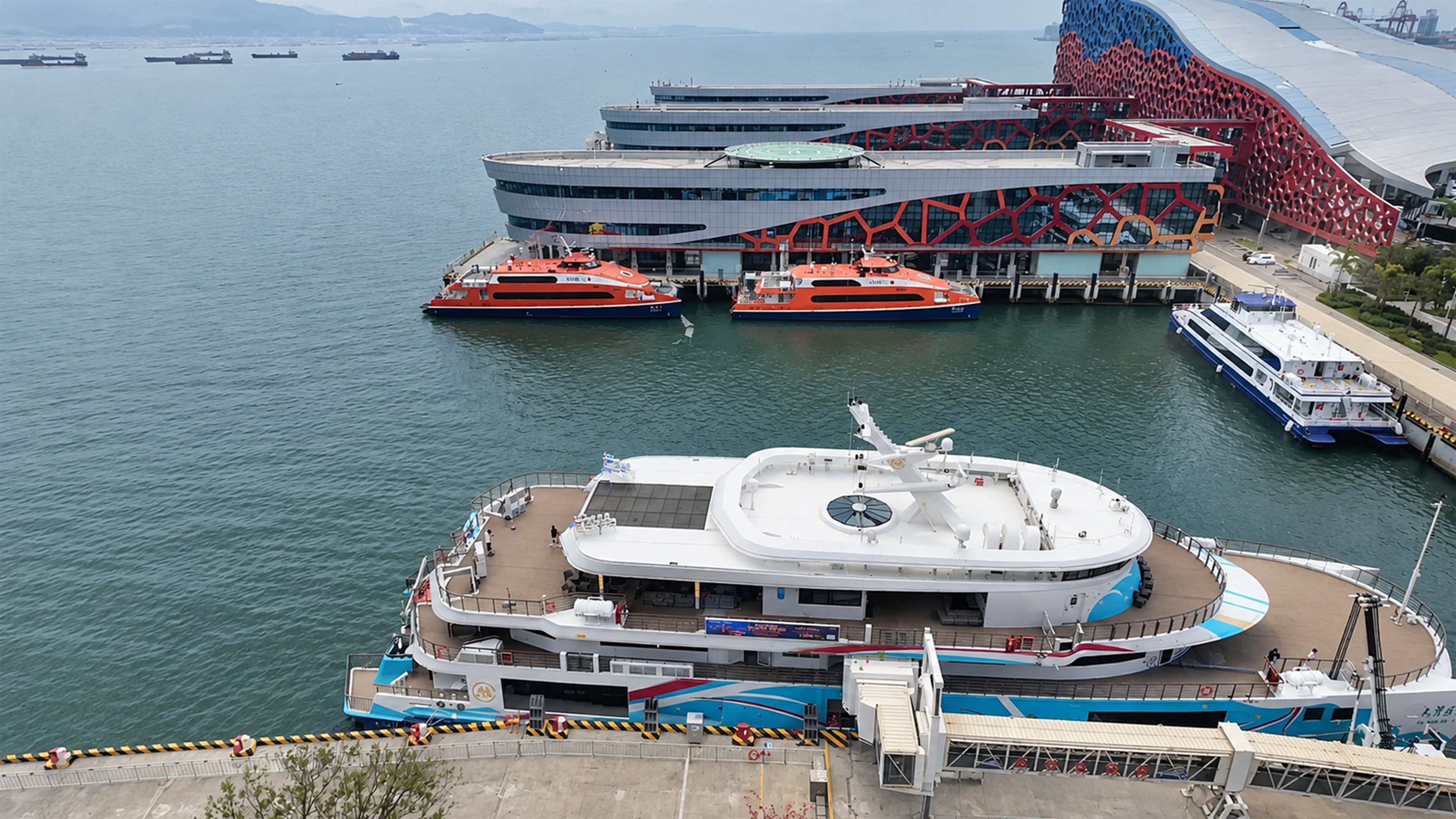 Ferries and modern architecture meet along China’s busy harbor