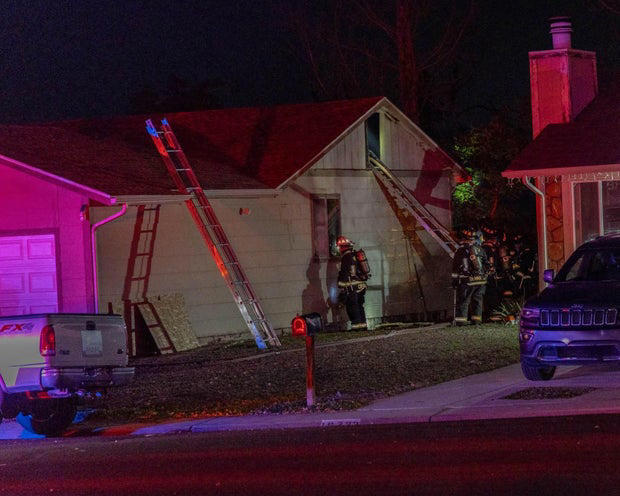 Aurora firefighter falls through the floor while battling house fire