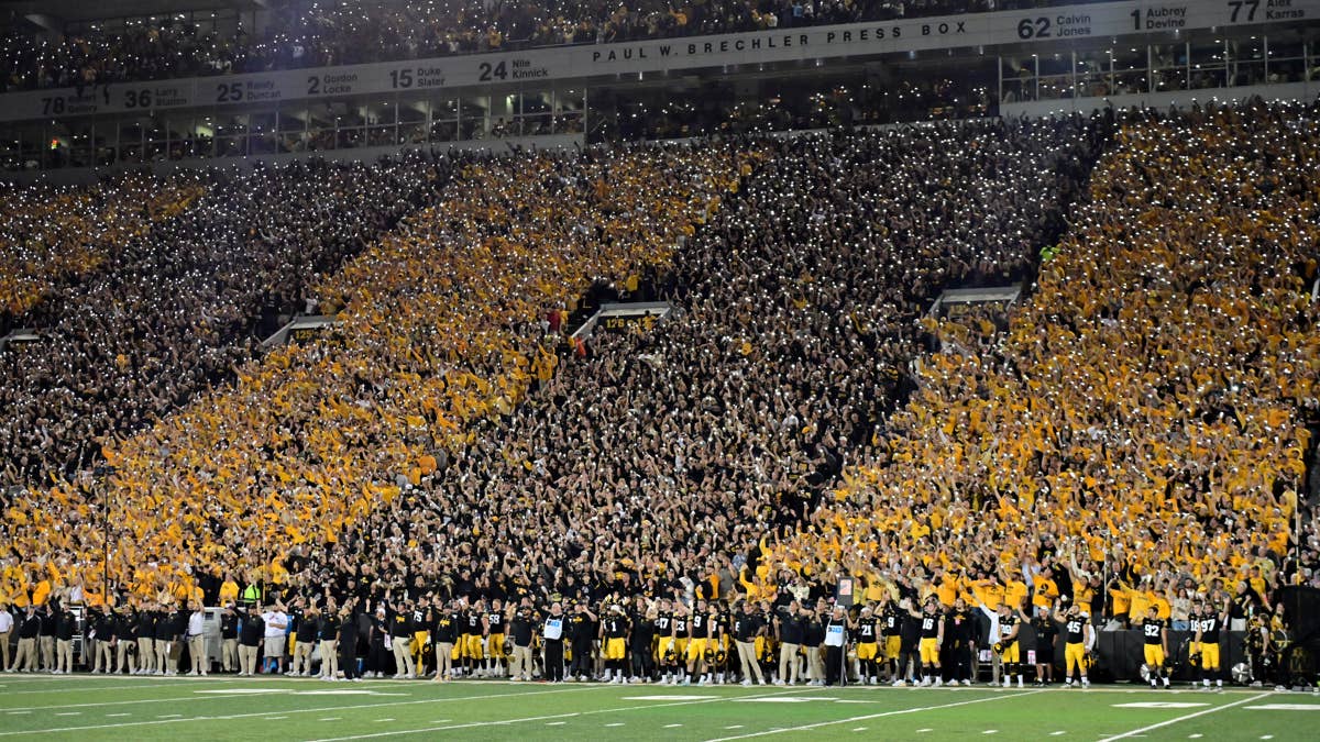 Discover the heartwarming Hawkeye wave tradition at Iowa football games