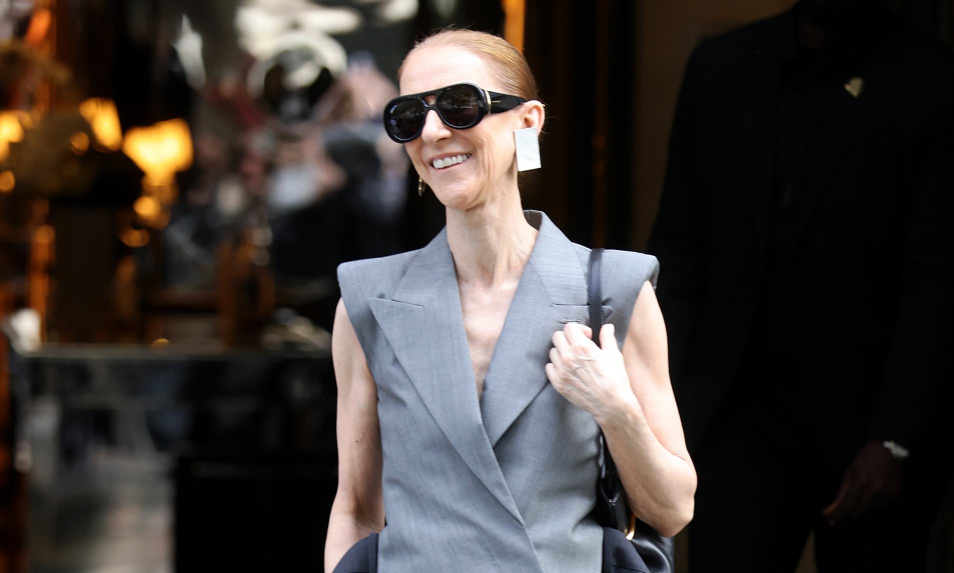 Celine Dion continues her fashion parade in a chic grey look in Paris ...