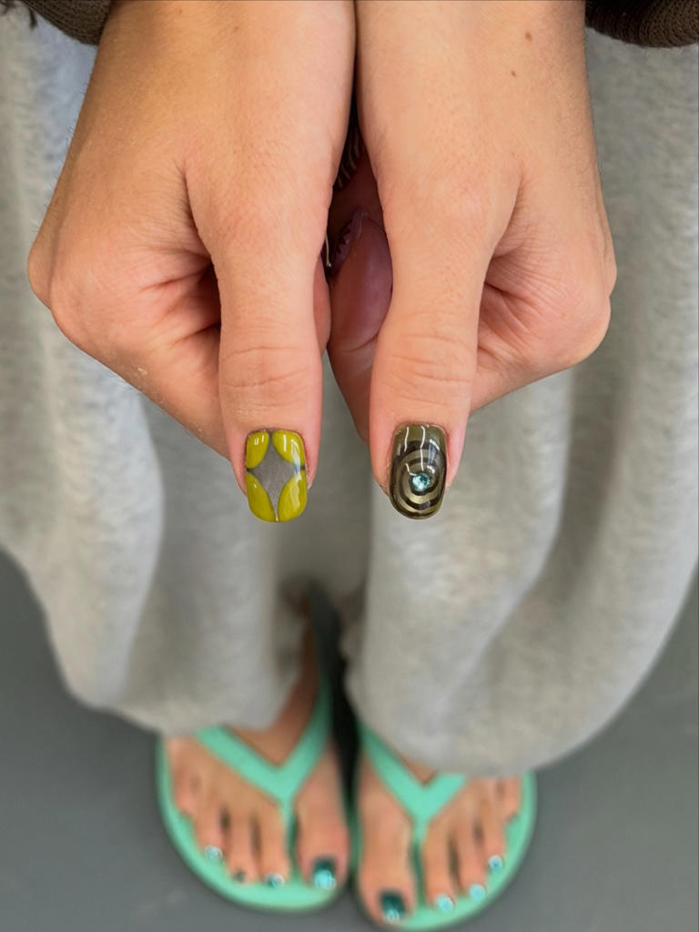 October nail trends feature darker tones and subtle witchy influences
