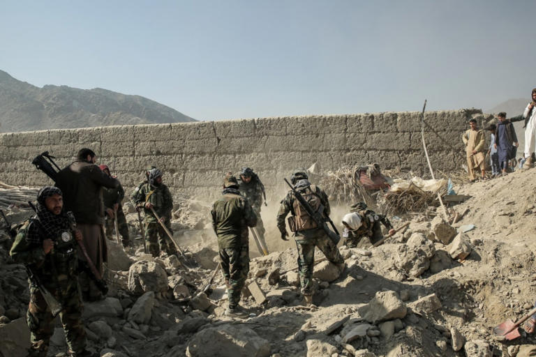 Taliban security personnel search for victims after an overnight Pakistani air strike hit a residential area at the Girdi Kas village in Bihsud district, Nangarhar province on February 22, 2026. (AFP photo)