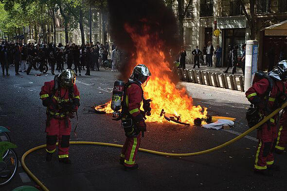 Paris riots: French capital in flames as hundreds of furious protesters ...