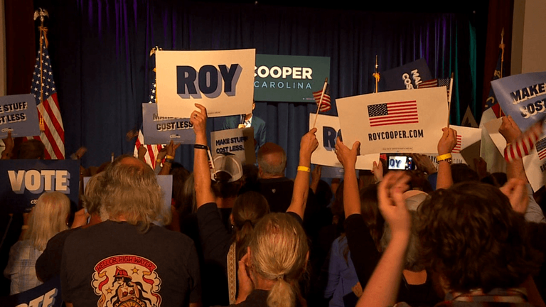 With election day a month away, Roy Cooper campaigns in Asheville