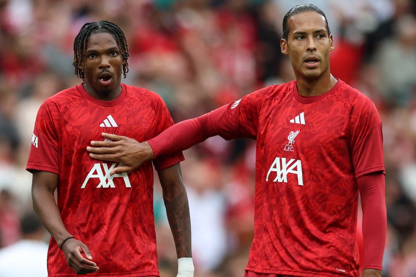 Liverpool's French defender #05 Jeremy Jacquet (L) warms up with Liverpool's Dutch defender #04 Virgil van Dijk (R) before the pre-season friendly football match between Liverpool and Como at Anfield in Liverpool, north west England on August 16, 2026. (Photo by Darren Staples / AFP via Getty Images)
