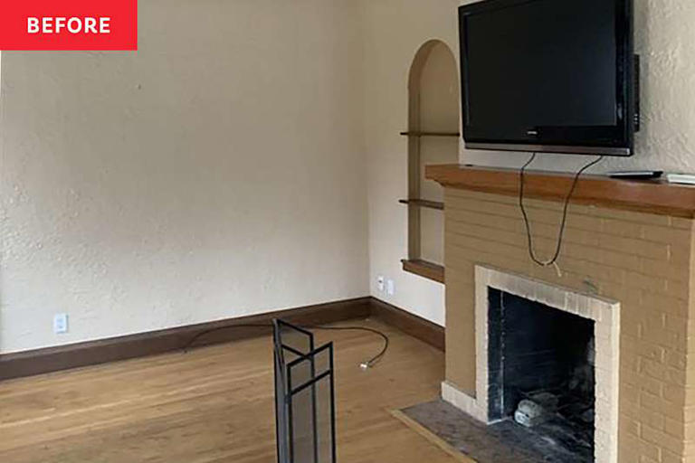 This bungalow's striking fireplace is so green, it's almost black